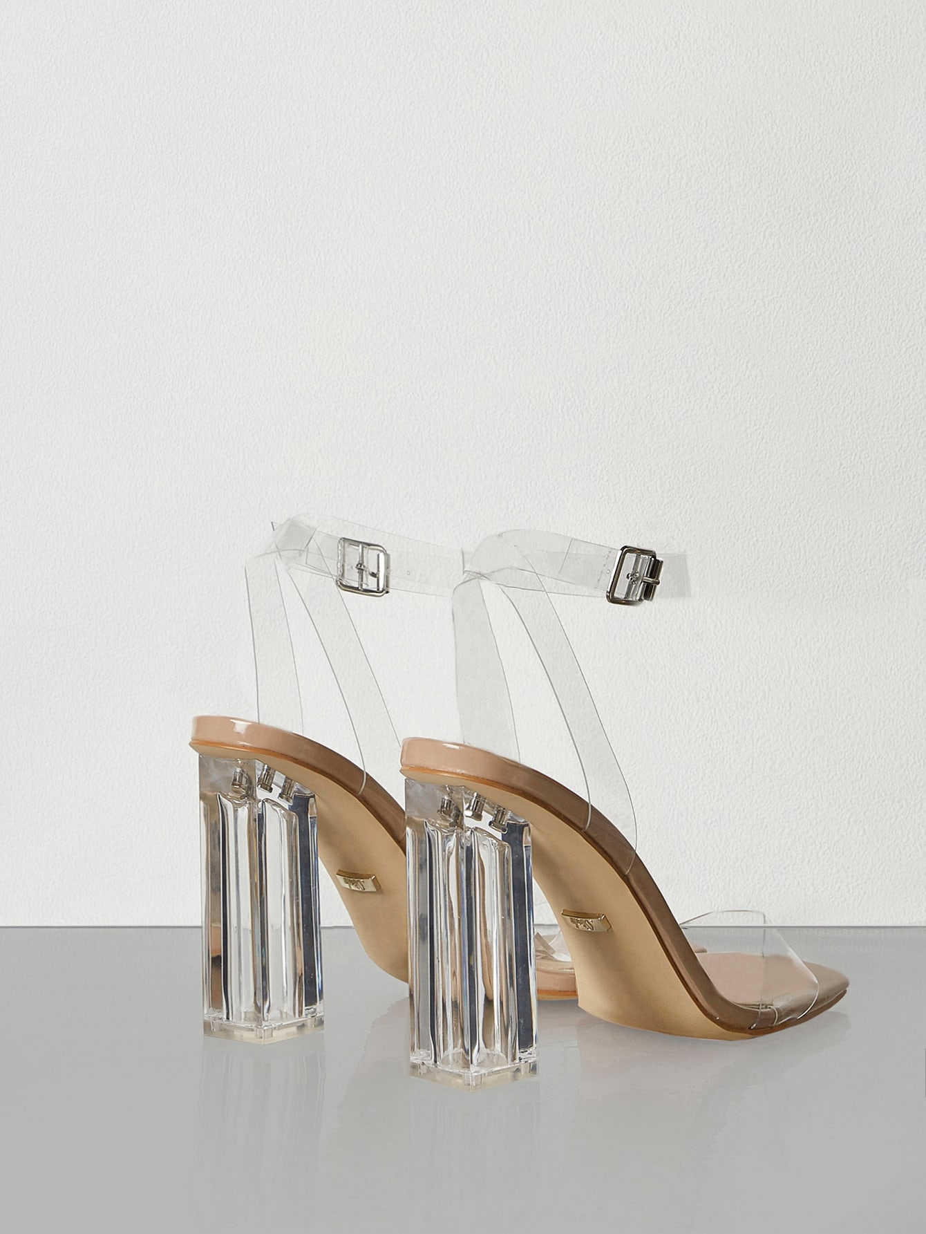 In Clear Women Heeled Sandals